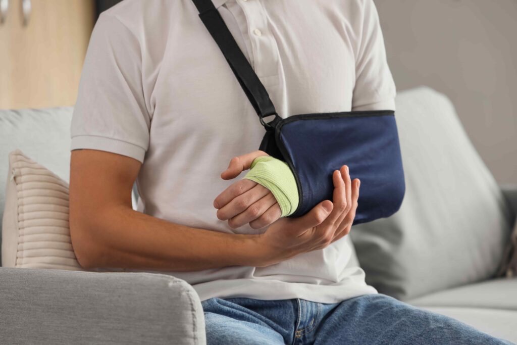 Man with injured arm as a results of an accident