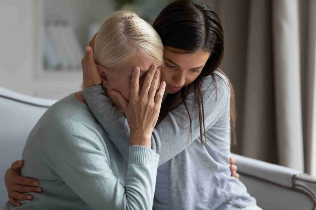 Women grieving the loss of a loved one