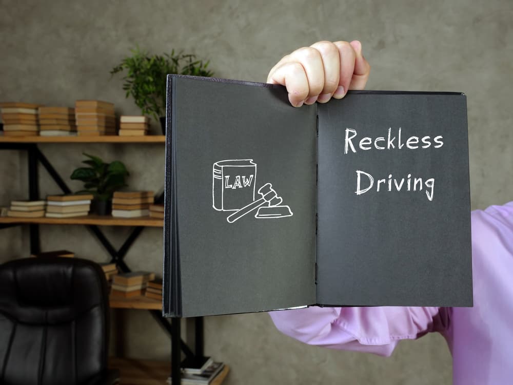 Reckless Driving with phrase on the piece of paper