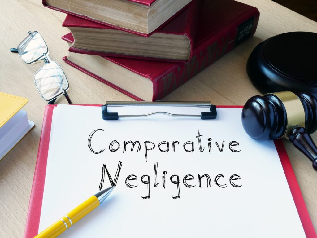 Comparative negligence concept with legal books and gavel illustrating Pennsylvania modified comparative fault rule